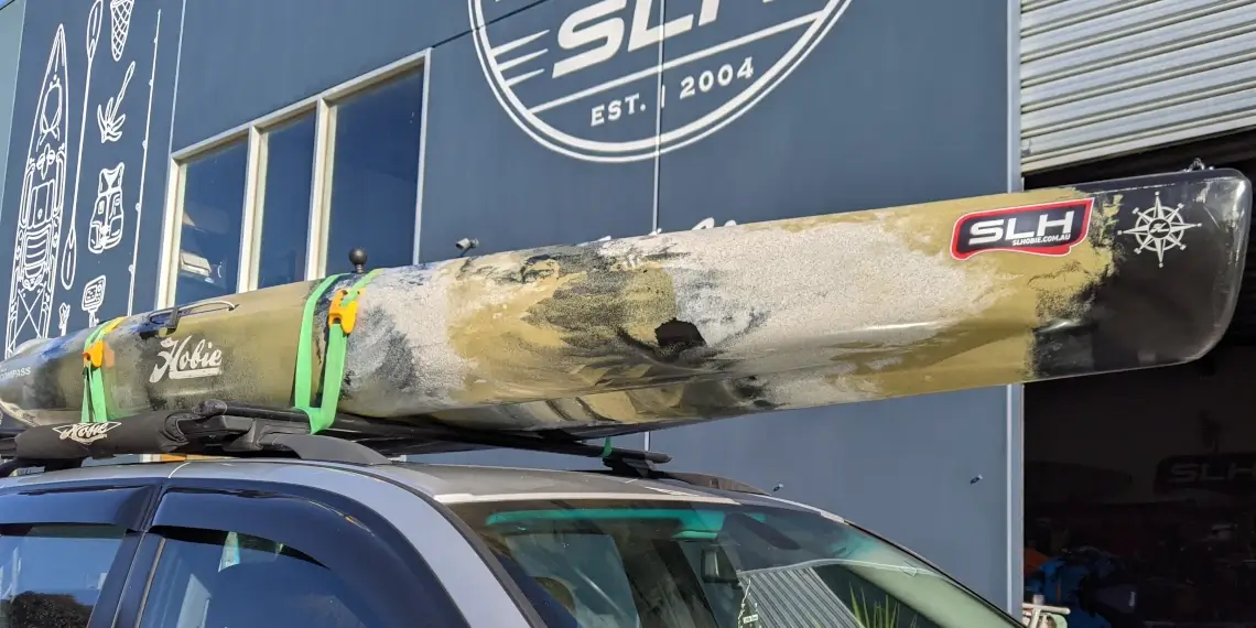 Hobie kayak strapped onto roof racks